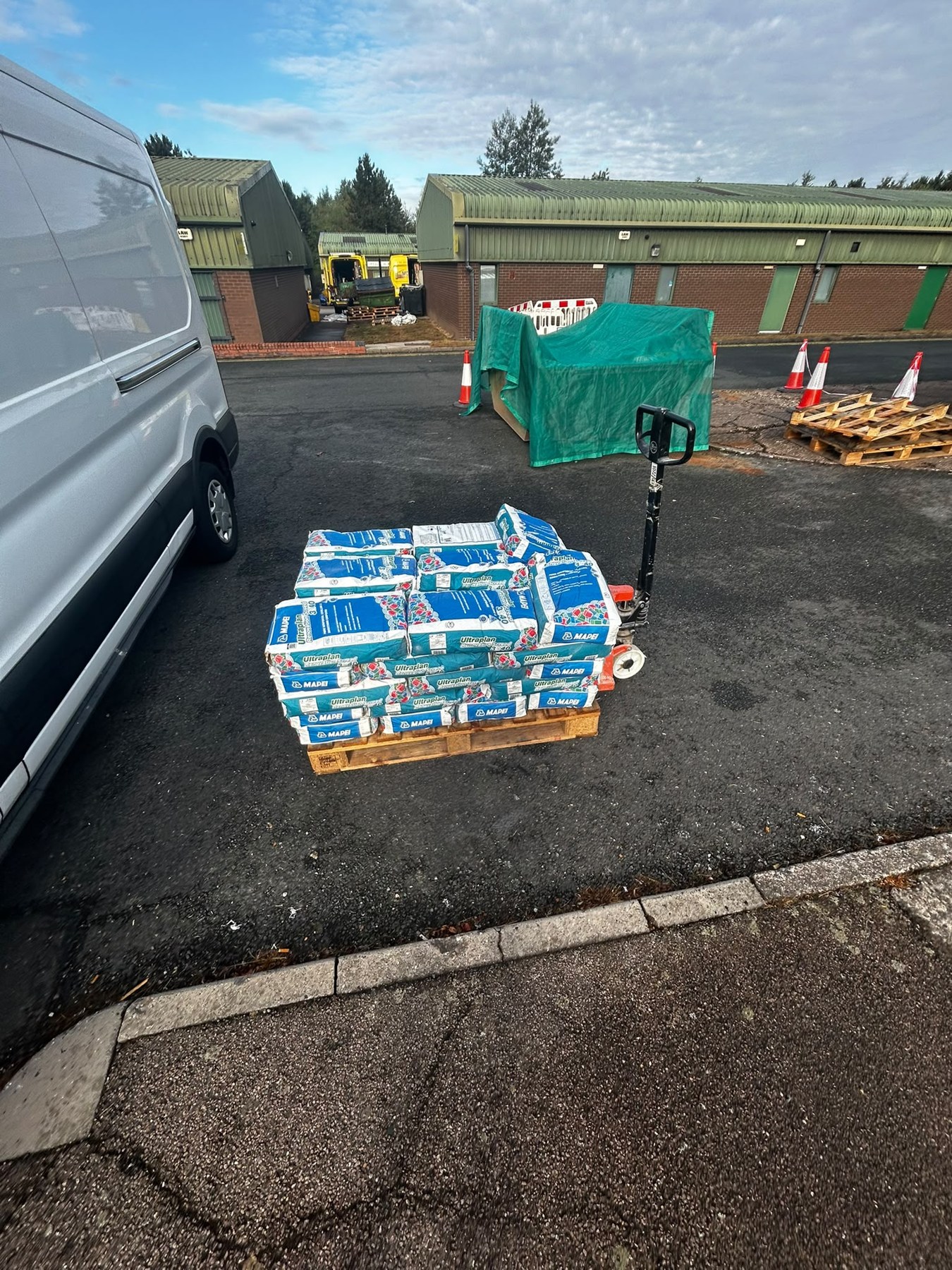 The bagged materials off the van on a pallet truck in Cannock.